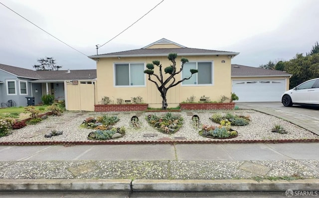 view of front of house featuring crawl space, a garage, and concrete driveway