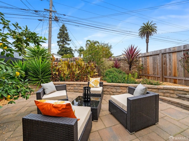 view of patio / terrace with a fenced backyard and an outdoor living space