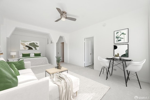 carpeted living room featuring ceiling fan