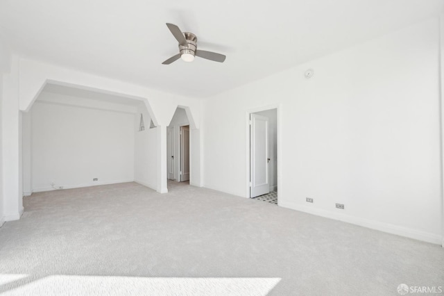 interior space featuring ceiling fan and light carpet