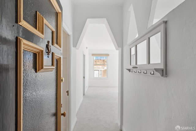 hallway with light carpet