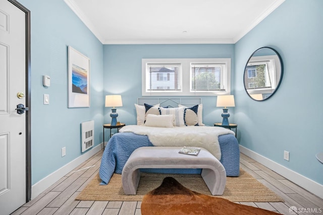 bedroom featuring ornamental molding and heating unit