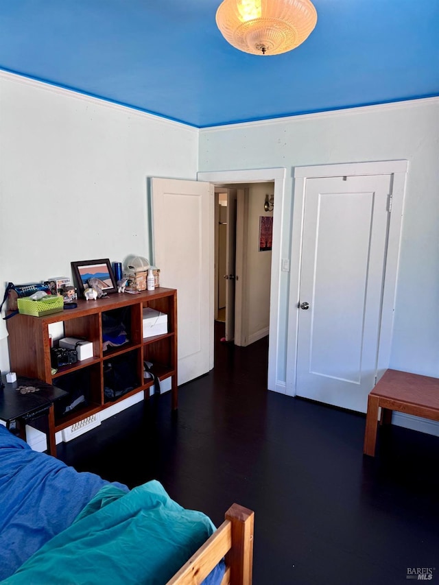 bedroom featuring dark wood-type flooring