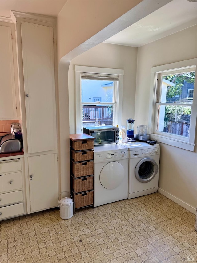 laundry area featuring washing machine and clothes dryer