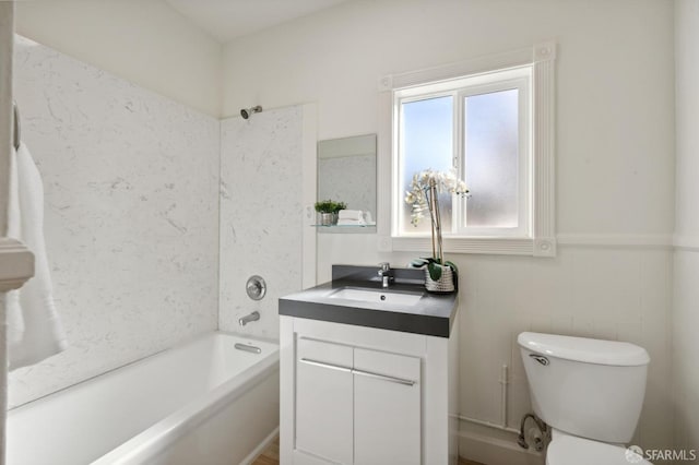 full bathroom featuring toilet, vanity, and shower / bathtub combination