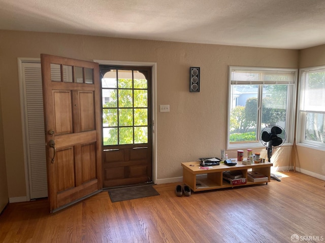 21723 Ada St, Castro Valley, CA 94546 - entryway with a textured wall, baseboards, and wood finished floors