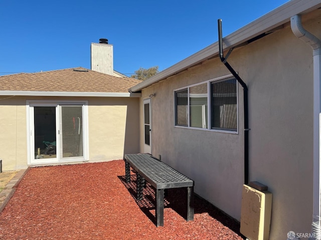 21723 Ada St, Castro Valley, CA 94546 - rear view of house featuring stucco siding and a chimney