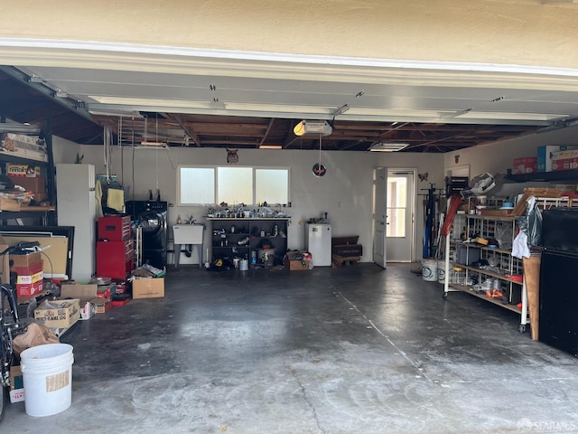 21723 Ada St, Castro Valley, CA 94546 - garage with a garage door opener, a workshop area, and a sink