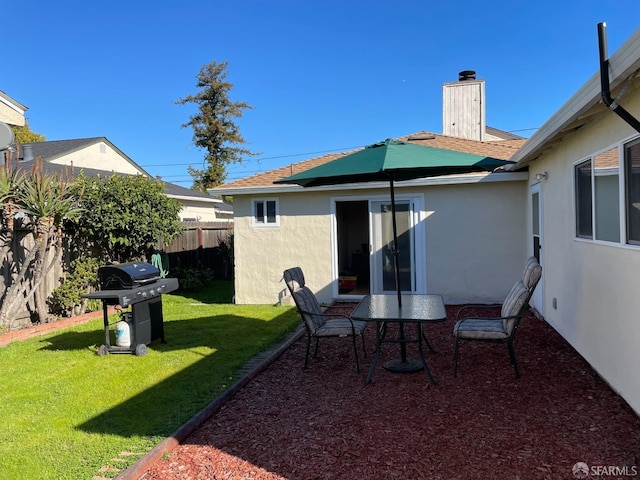 21723 Ada St, Castro Valley, CA 94546 - rear view of property featuring fence, a chimney, a yard, and stucco siding