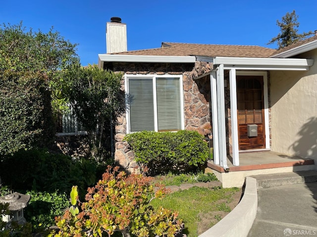 21723 Ada St, Castro Valley, CA 94546 - entrance to property featuring stone siding, a chimney, and stucco siding