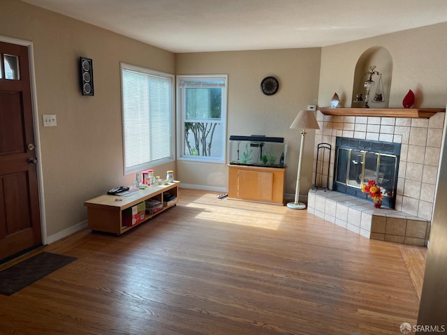 21723 Ada St, Castro Valley, CA 94546 - living room featuring wood finished floors, baseboards, and a fireplace