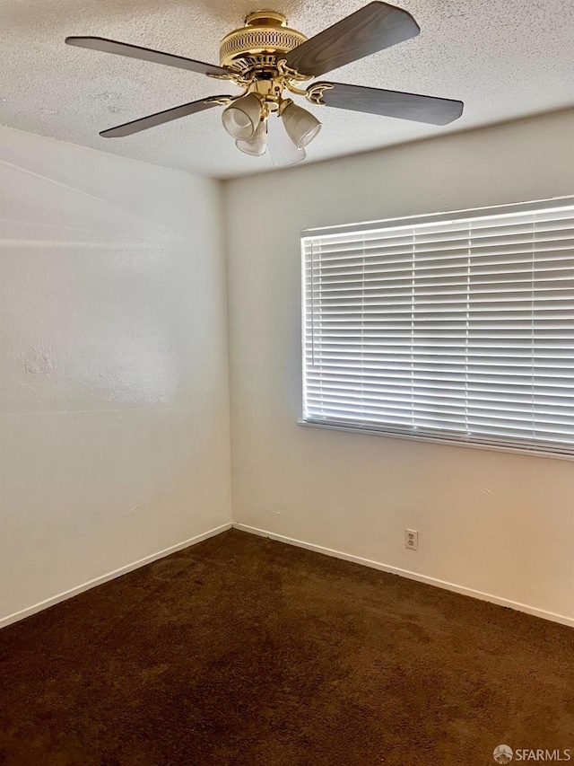 933 41st St, Oakland, CA 94608 - unfurnished room with a textured ceiling, ceiling fan, baseboards, and dark colored carpet
