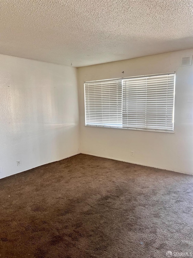 933 41st St, Oakland, CA 94608 - spare room with carpet, a textured ceiling, and visible vents