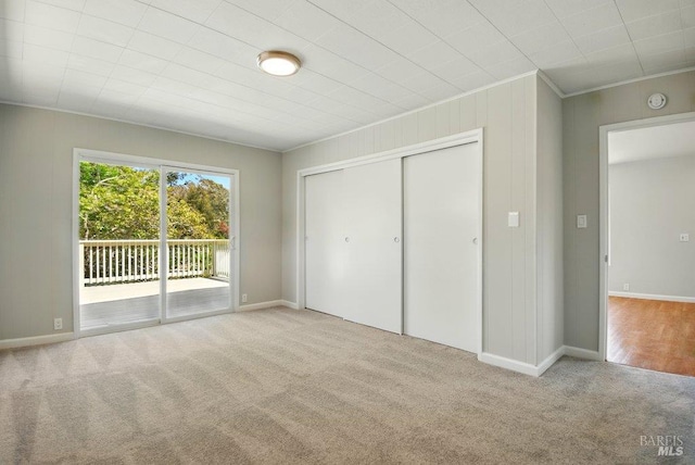 1685 Bay Flat Rd, Bodega Bay, CA 94923 - unfurnished bedroom featuring carpet, access to exterior, crown molding, a closet, and baseboards