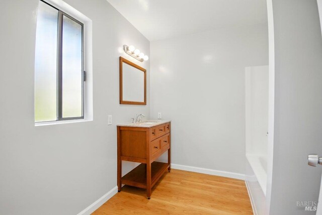 1685 Bay Flat Rd, Bodega Bay, CA 94923 - bathroom with vanity, wood finished floors, and baseboards