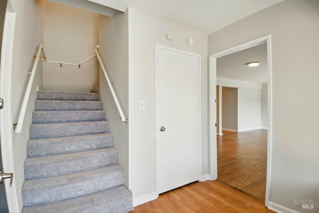 1685 Bay Flat Rd, Bodega Bay, CA 94923 - stairs with wood finished floors and baseboards