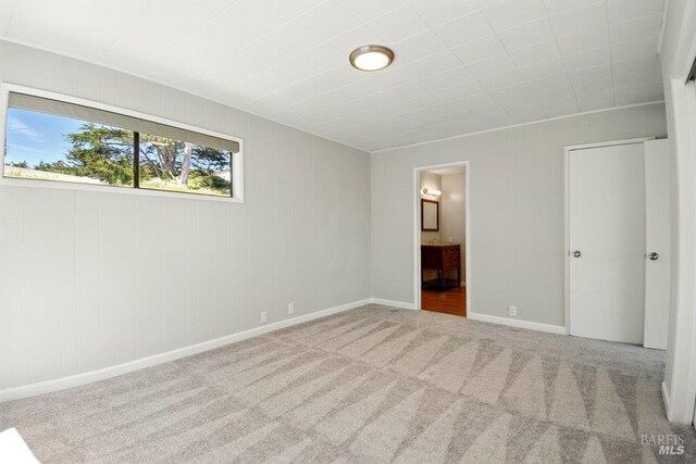 1685 Bay Flat Rd, Bodega Bay, CA 94923 - unfurnished bedroom with carpet, baseboards, and connected bathroom