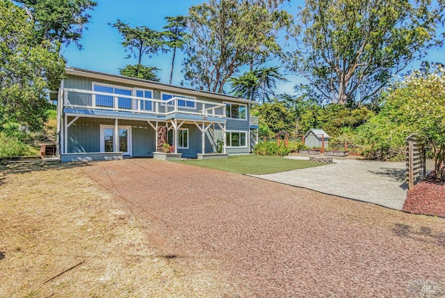 1685 Bay Flat Rd, Bodega Bay, CA 94923 - view of front property featuring a front yard and a wooden deck