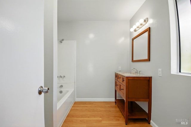1685 Bay Flat Rd, Bodega Bay, CA 94923 - bathroom with vanity, wood finished floors, shower / bathtub combination, and baseboards
