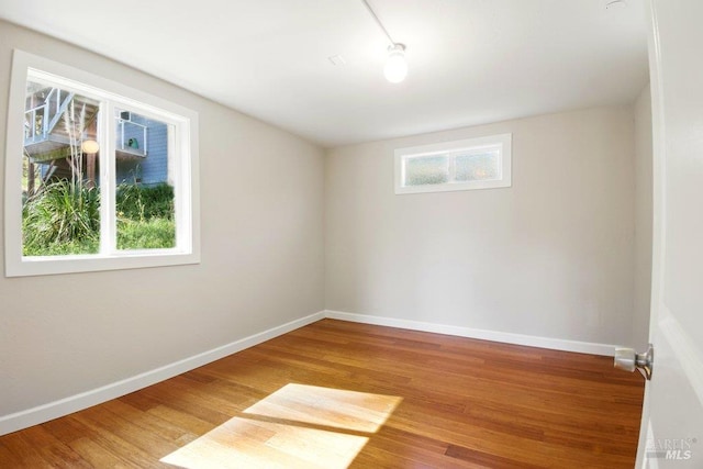1685 Bay Flat Rd, Bodega Bay, CA 94923 - empty room with wood finished floors and baseboards