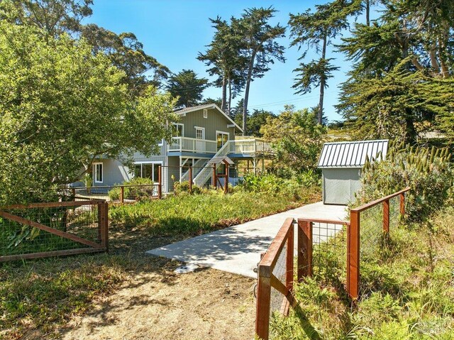 1685 Bay Flat Rd, Bodega Bay, CA 94923 - view of yard featuring stairway and a wooden deck