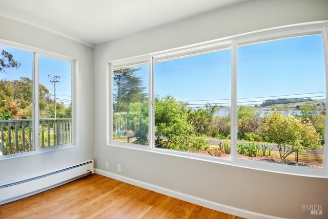 1685 Bay Flat Rd, Bodega Bay, CA 94923 - empty room featuring baseboard heating, baseboards, and light wood-type flooring