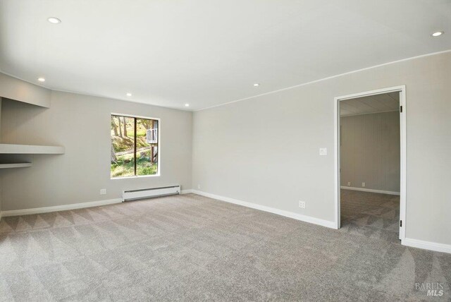 1685 Bay Flat Rd, Bodega Bay, CA 94923 - unfurnished living room featuring a baseboard heating unit, carpet flooring, recessed lighting, and baseboards