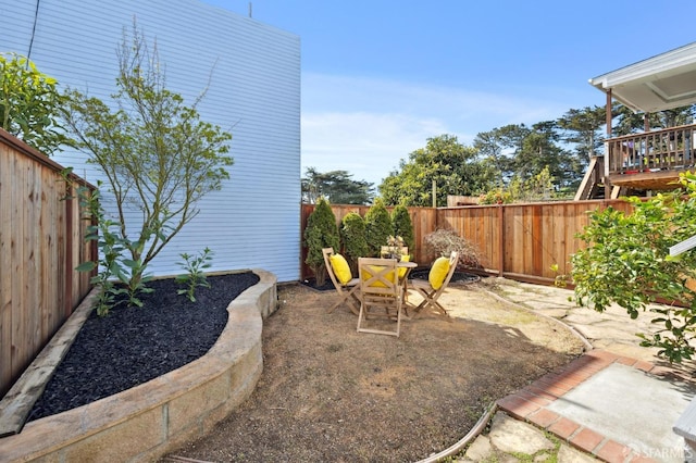 view of yard featuring a patio area and a fenced backyard