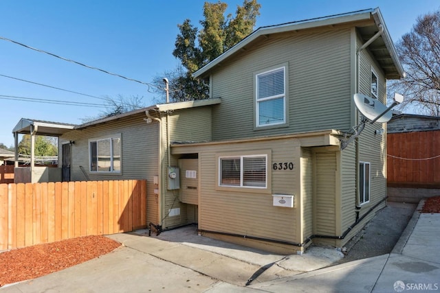 view of front of house featuring fence