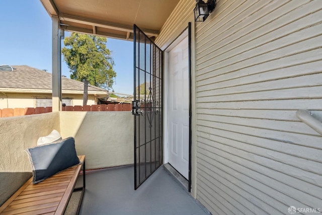 entrance to property with a balcony