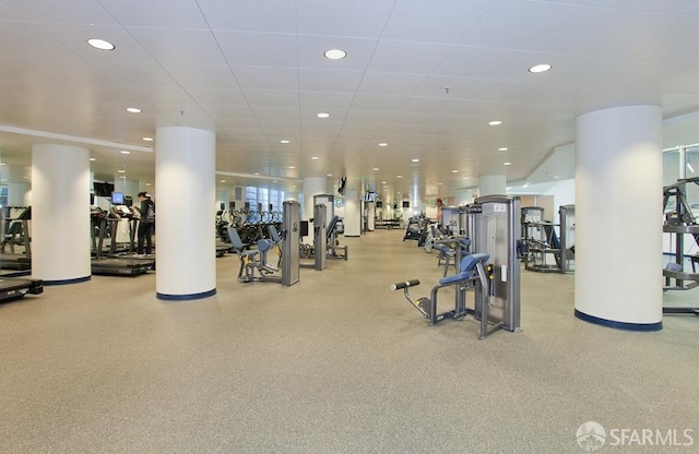 exercise room featuring a drop ceiling