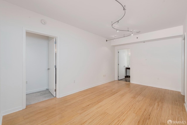 empty room with light hardwood / wood-style floors