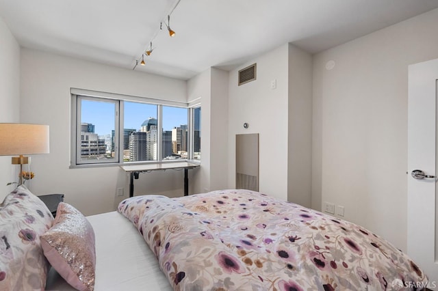 333 1st St Unit N1404, San Francisco, CA 94105 - bedroom with a skyline view and rail lighting