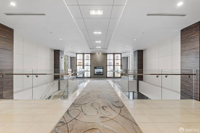 333 1st St Unit N1404, San Francisco, CA 94105 - building lobby featuring tile walls and recessed lighting