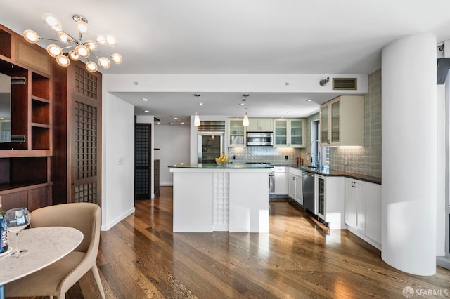 333 1st St Unit N1404, San Francisco, CA 94105 - kitchen featuring stainless steel appliances, dark wood finished floors, a sink, and dark countertops