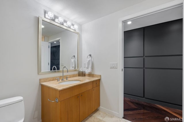 333 1st St Unit N1404, San Francisco, CA 94105 - bathroom with vanity, toilet, and baseboards