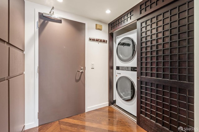 333 1st St Unit N1404, San Francisco, CA 94105 - washroom featuring stacked washer / drying machine, wood finished floors, and recessed lighting