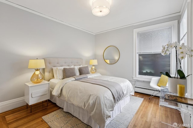 1250 Vallejo St Unit 2, San Francisco, CA 94109 - bedroom with wood finished floors, a baseboard radiator, and crown molding