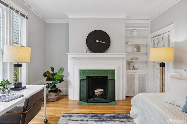 1250 Vallejo St Unit 2, San Francisco, CA 94109 - bedroom featuring crown molding, wood finished floors, and a fireplace
