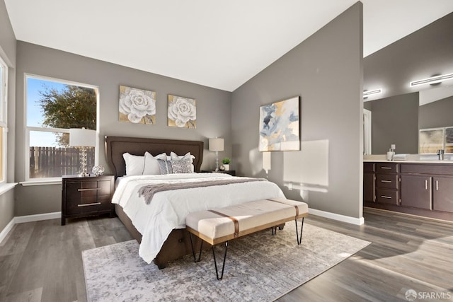 1017 Rockspring Way, Antioch, CA 94531 - bedroom with wood finished floors, vaulted ceiling, and connected bathroom
