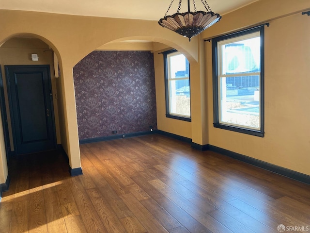 unfurnished room featuring dark hardwood / wood-style flooring