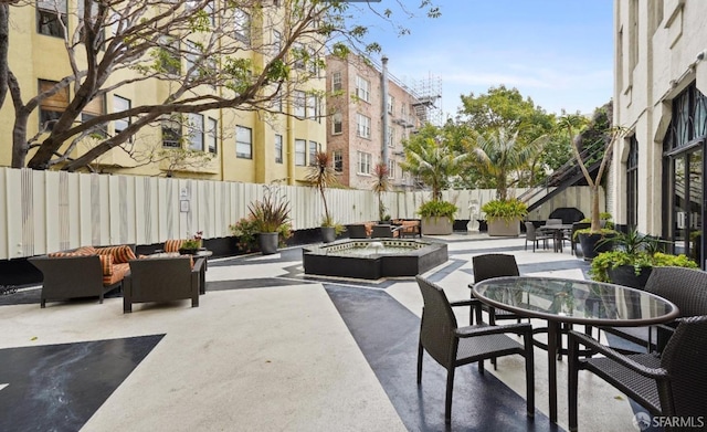 view of patio / terrace with an outdoor fire pit