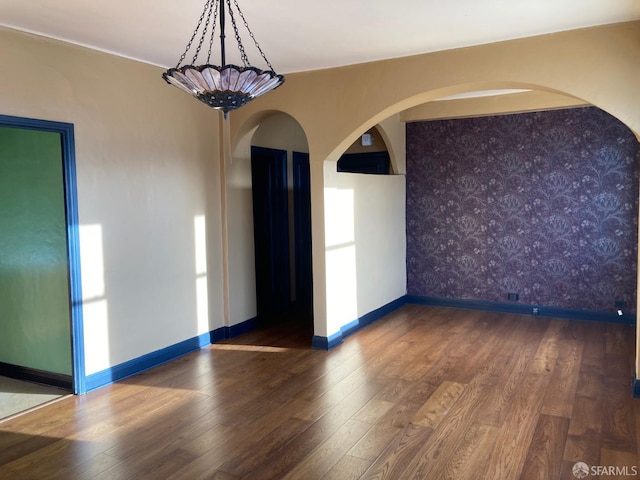 unfurnished room featuring dark hardwood / wood-style floors