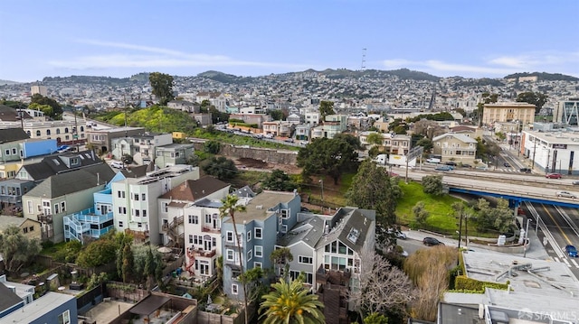 birds eye view of property featuring a city view and a mountain view