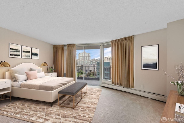 1200 Gough St Unit 4B, San Francisco, CA 94109 - carpeted bedroom featuring a baseboard radiator, access to exterior, a textured ceiling, and a city view