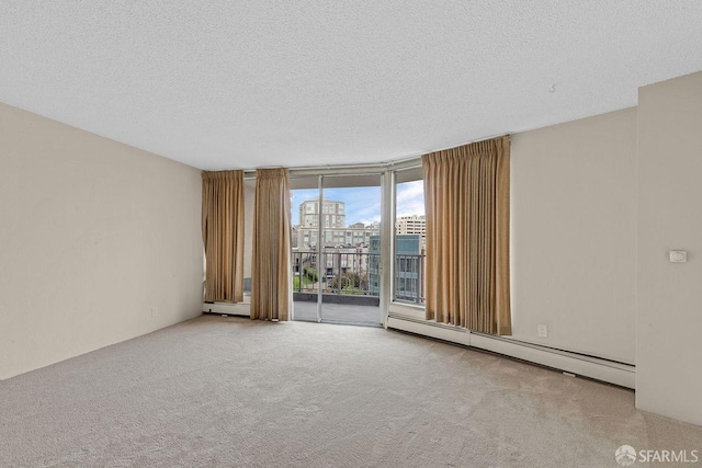 1200 Gough St Unit 4B, San Francisco, CA 94109 - spare room with baseboard heating, a wall of windows, a textured ceiling, and carpet floors