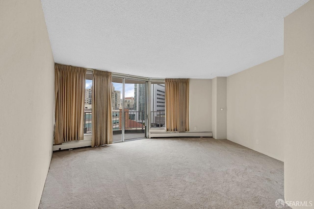 1200 Gough St Unit 4B, San Francisco, CA 94109 - carpeted spare room featuring a textured ceiling and a baseboard heating unit
