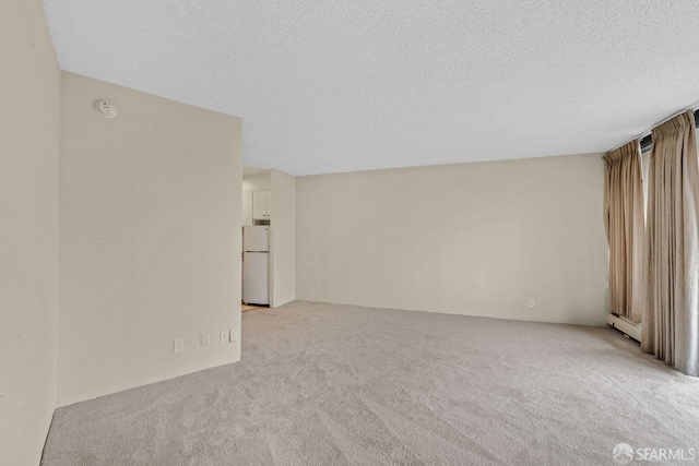 1200 Gough St Unit 4B, San Francisco, CA 94109 - carpeted empty room with a textured ceiling and a smoke detector