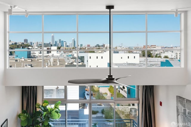 interior details featuring ceiling fan and track lighting