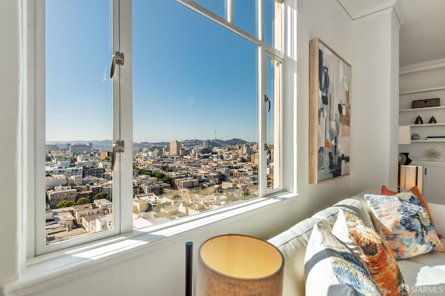 bedroom featuring a view of city and ornamental molding